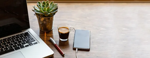Minimal workspace with laptop and natural light